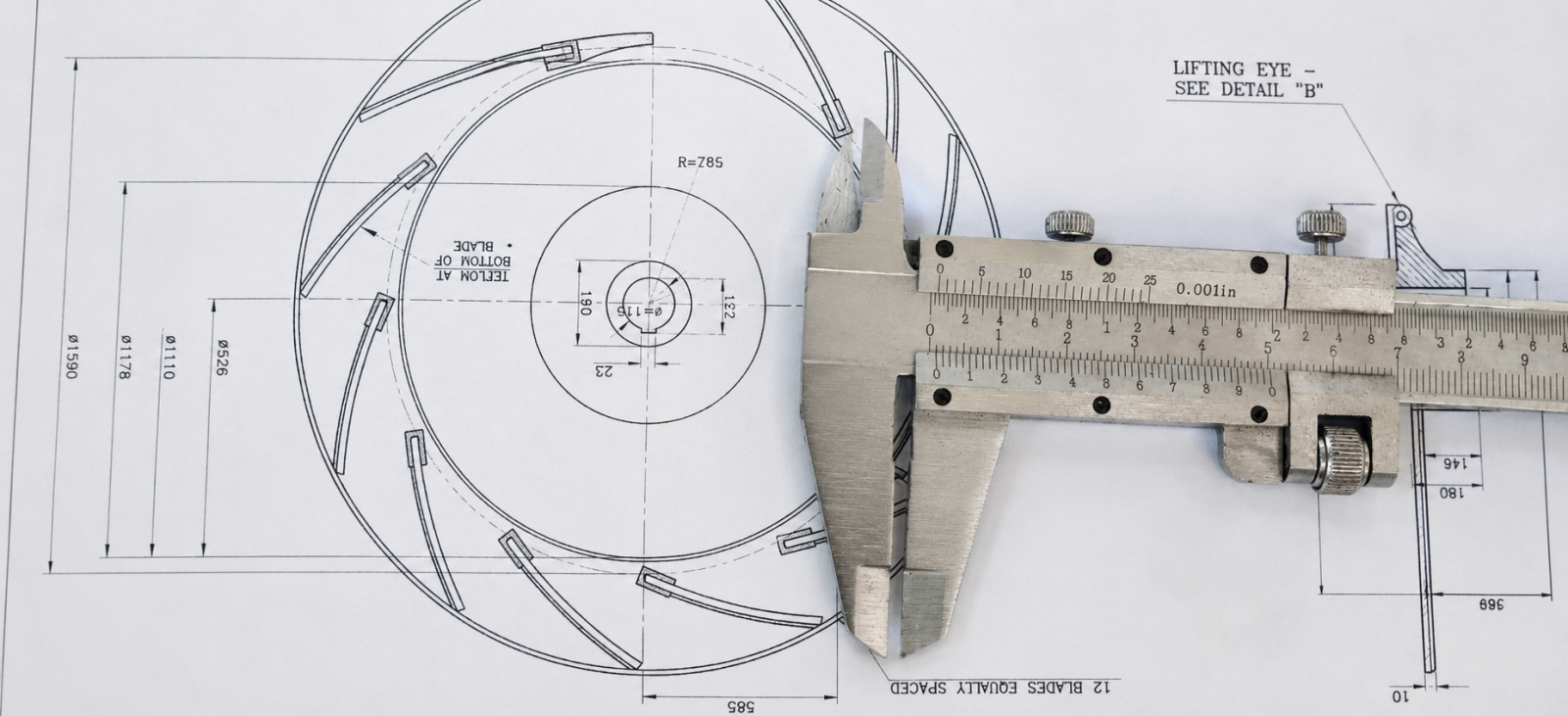 Vernier caliper measuring a component on an engineering drawing