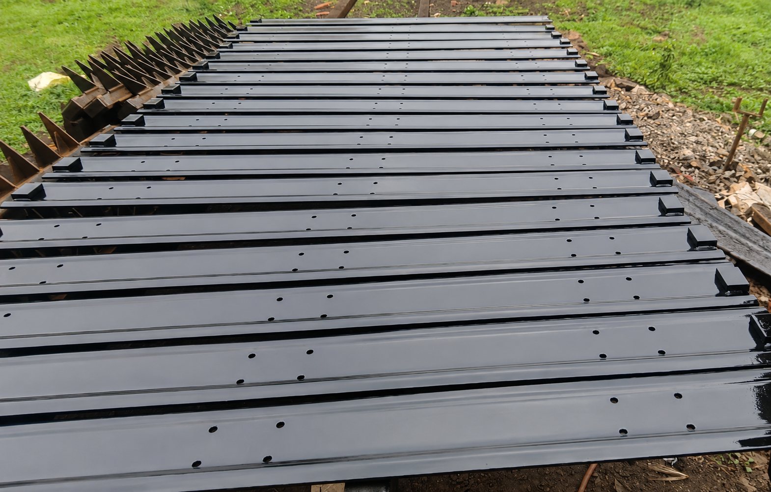 Fabricated cane carrier slats laid out side by side